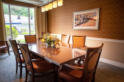 Elegant dining room with a large table and flowers