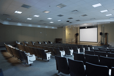 Interior view of a spacious activity room with seating