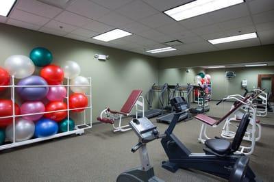Well-equipped fitness room with exercise equipment
