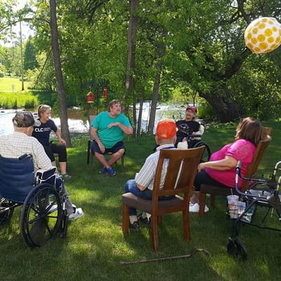 Residents enjoying a gathering by the river