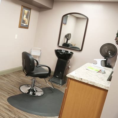 Beauty salon chair and mirror in an interior room