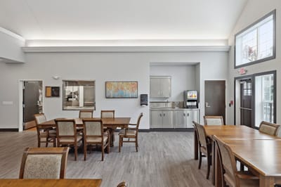 Bright dining area with tables and chairs