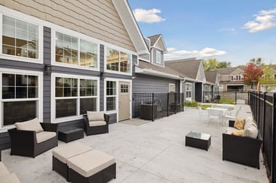 Outdoor seating area with furniture and views of the facility