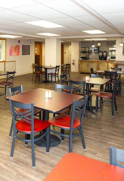 Interior view of a dining area with tables and chairs