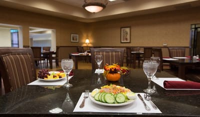 Dining table set with meals in a bright dining area