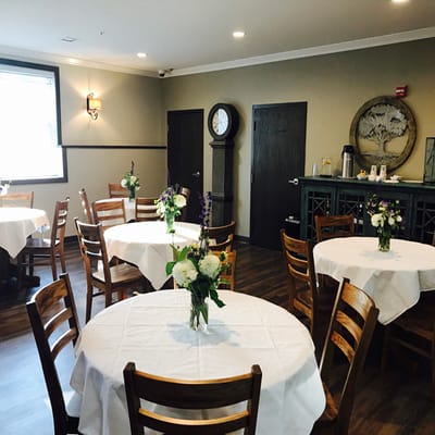 Dining area with tables and floral centerpieces