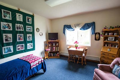 Cozy resident room with a bed and desk