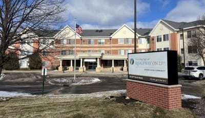Vista Prairie At Ridgeway On G, assisted living in New Ulm, MN — Senior living facility with entrance and American flag