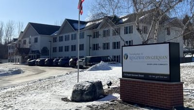 Vista Prairie At Ridgeway On G, assisted living in New Ulm, MN — Senior living facility entrance with parking area and flagpole