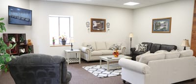 Bright common area with seating and decor