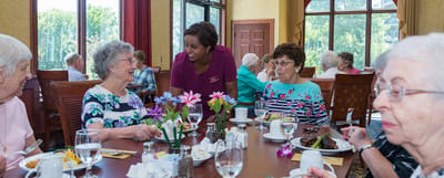 Residents enjoying a meal in the dining room
