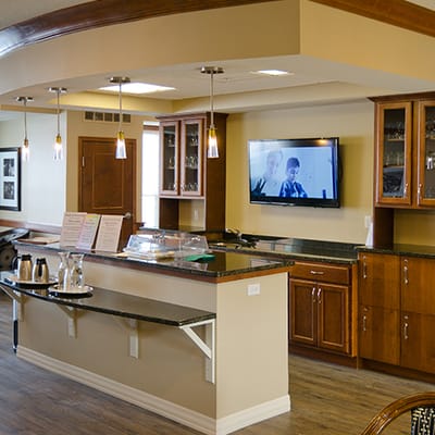 Interior view of a common area with a bar and television