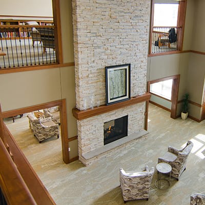 Interior view of a cozy common area with a fireplace
