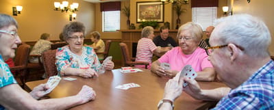 Residents playing cards in a common area