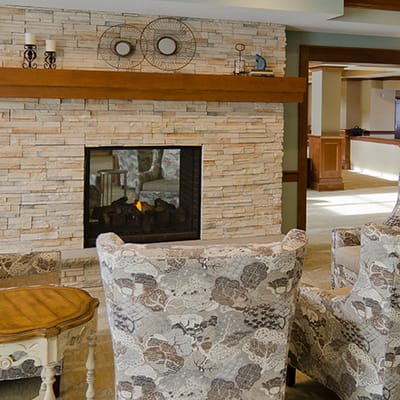 Cozy common area with seating and fireplace