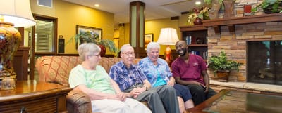 Residents and staff enjoying time together in a common area