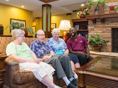 Residents and staff enjoying time together in a common area