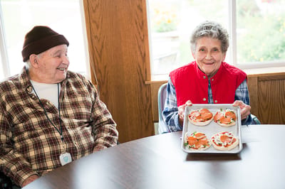 Residents enjoying a meal together in a dining area