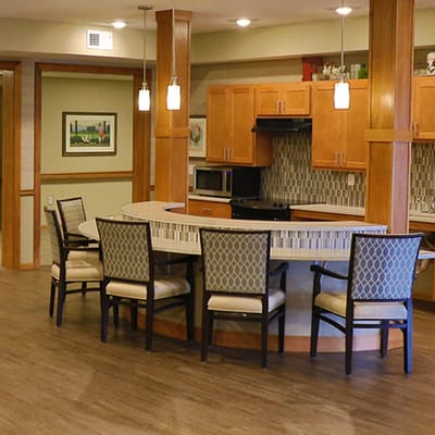 Interior view of a communal kitchen area with seating