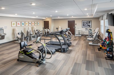 Well-equipped fitness room with exercise machines