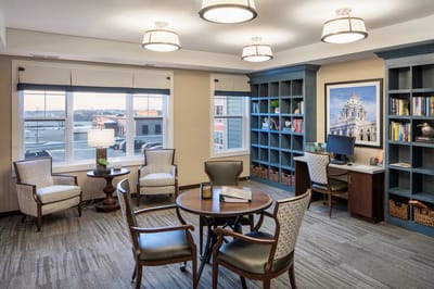 Cozy common area with seating and bookshelves