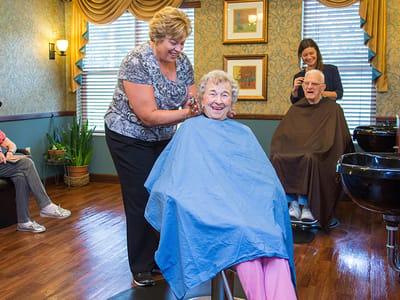 Residents enjoying personal grooming services in a salon