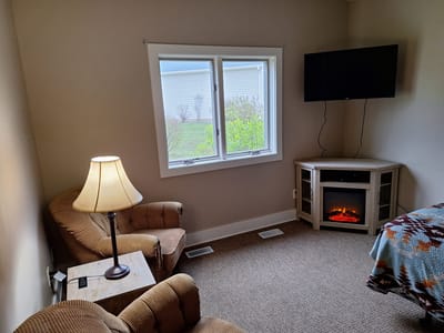 Comfortable resident room with seating and decor
