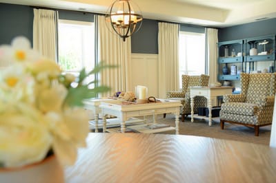 Bright common area with cozy seating and decor