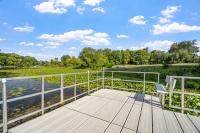 Scenic view of a calm water area with lily pads