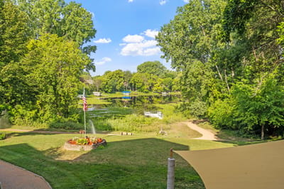 Picturesque view of a serene lake surrounded by greenery