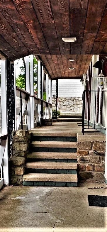 The Lodge Of New Hope LLC, assisted living in New Hope, MN — Covered entrance with stone steps leading inside