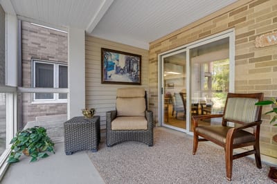 Seating area with chair and table on a porch