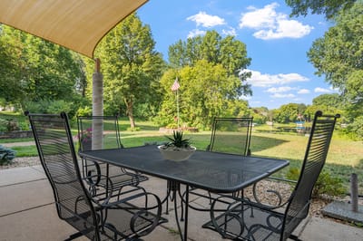 Outdoor seating area with a view of gardens