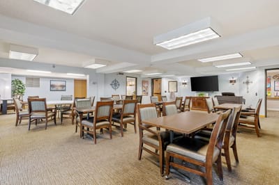 Bright and inviting common area with tables and chairs