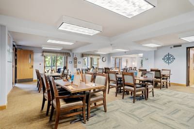 Interior view of a dining area with tables and chairs