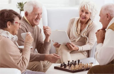 Residents enjoying a game of chess in a cozy setting