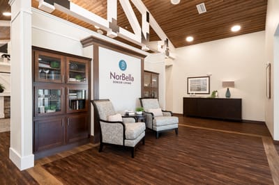 Interior view of a common area with NorBella branding