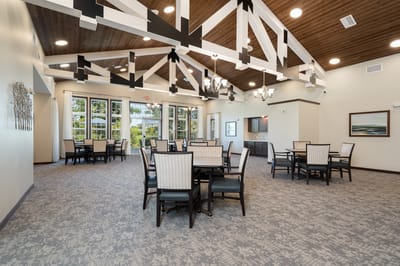 Bright dining area with tables and chairs