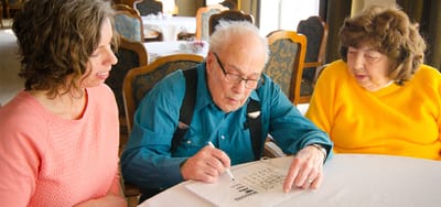 Residents and staff engaging in a bingo game