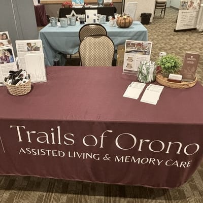 Table display featuring Trails of Orono materials