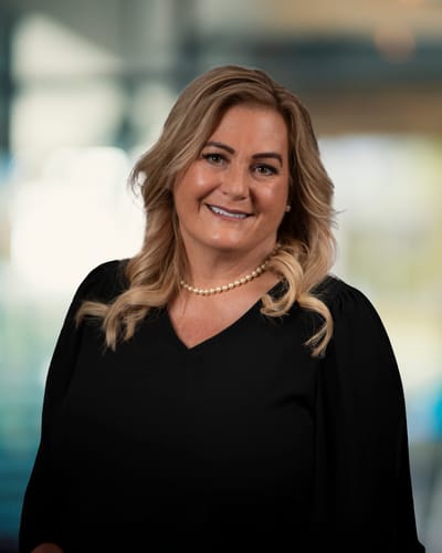 Portrait of a smiling staff member in a facility environment