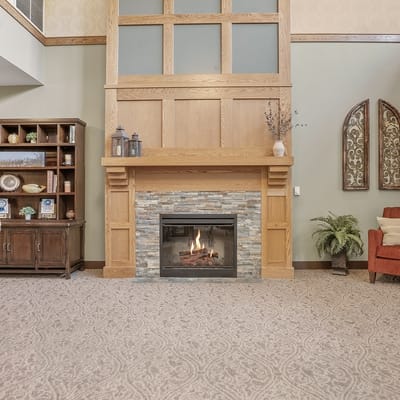 Interior common area with a fireplace and seating