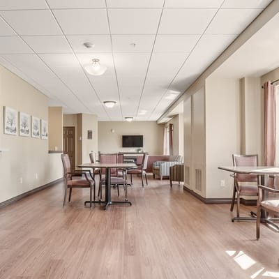 Bright common area with tables and chairs