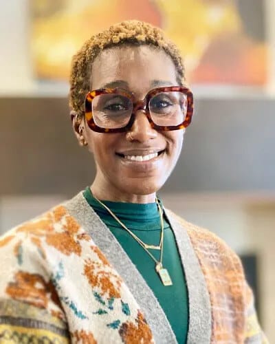 Staff member smiling in a common area