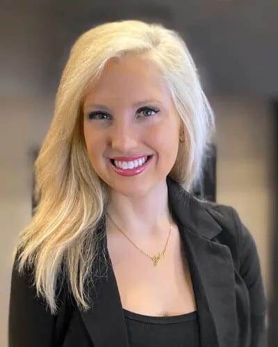 A smiling staff member in a professional setting