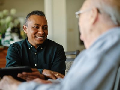 Staff member engaging with a resident indoors