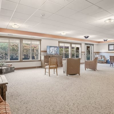 Bright common area with seating and windows