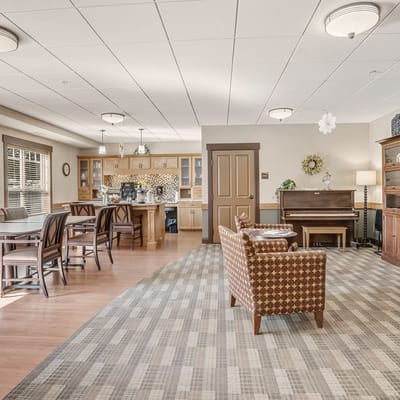 Common area with seating and a piano in the background