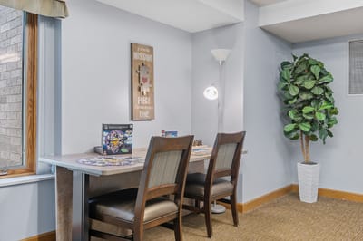 Common area with seating and games for residents