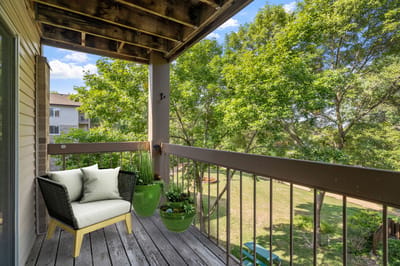 Balcony view with natural greenery and seating